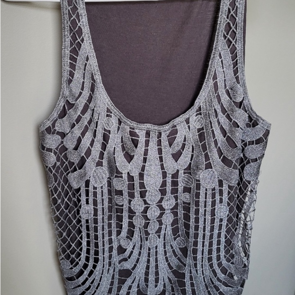 Gray/silver lace lined tank. Solid gray back. In new condition.
